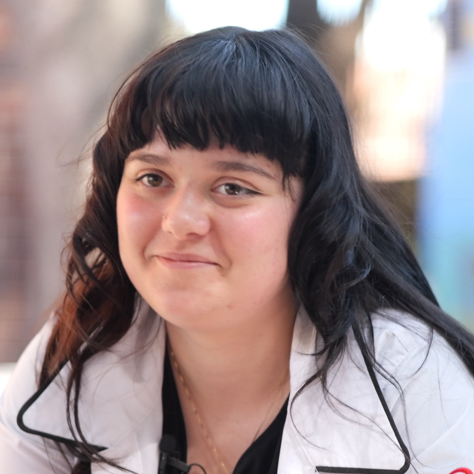 Chloe smiling at the camera